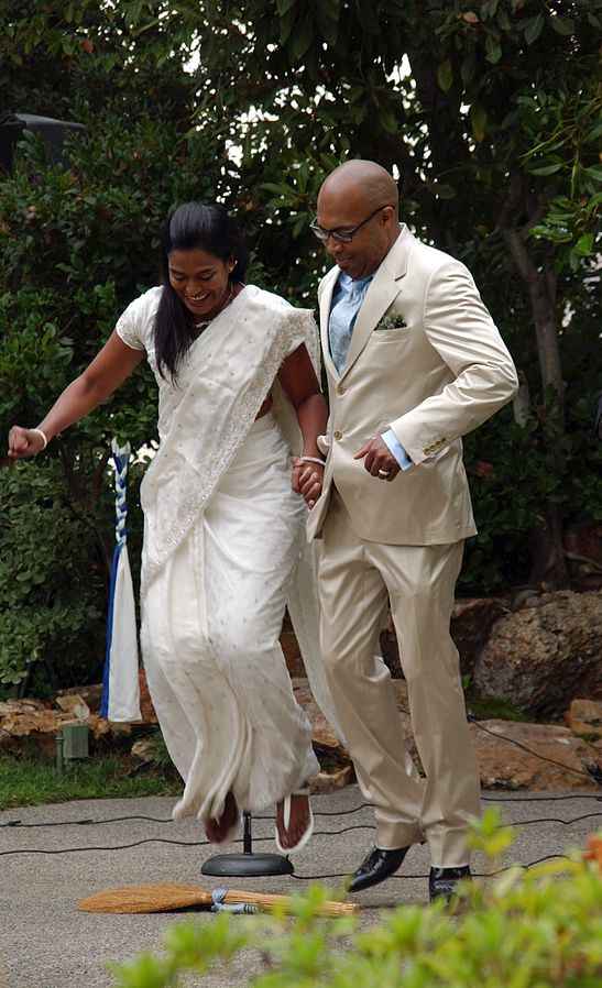 The wedding custom of jumping over a broomstick is an old one, but it has recently been making a comeback.