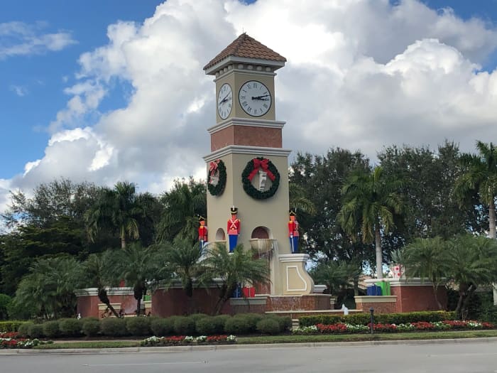 Life-sized wooden toy soldier decorations on the center clock tower fountain in my community.