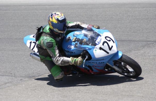 Steve Clark of Easy Bins Dumpster Rentals drags a knee around Willow Springs during a WERA National Endurance Race (circa 2005)