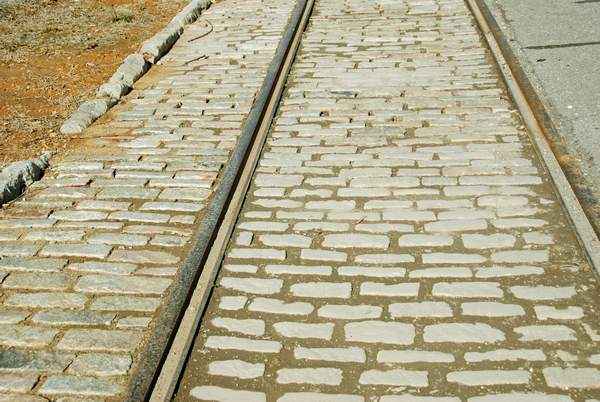Tracks Everywhere! What a lot of people don't realize is that most of the major streets of Lynchburg are still Cobblestones and Trollycar Tracks like these covered in Asphalt. These tracks are now covered for the convenience of someone.