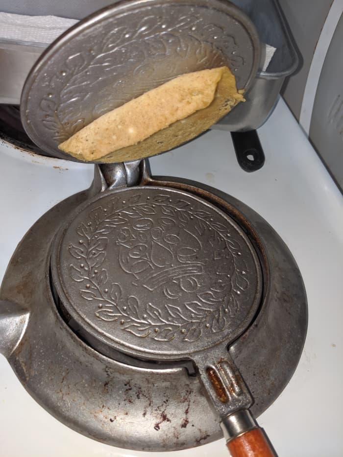 If it is sticking to top, turn over. It will stick to original side. Original side down when removing later, since you will need to roll before removing.