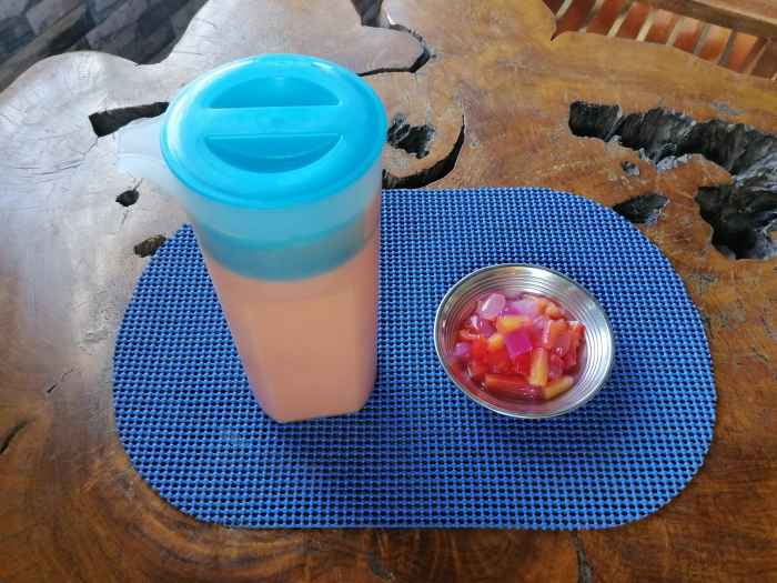 To make this milkshake, you'll need fresh papaya, fruit cocktail, and milk.