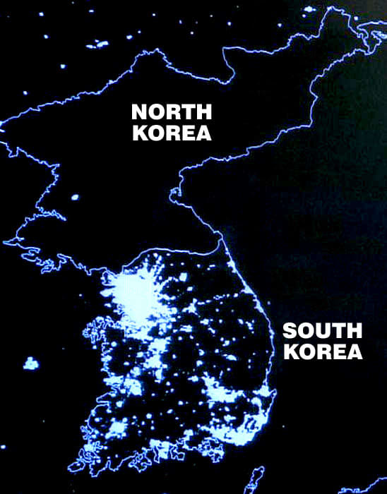 KOREA AT NIGHT; SOCIALIST NORTH POVERTY STRICKEN AND IN THE DARK; CAPITALIST SOUTH PROSPEROUS AND TOTALLY ELECTRIFIED