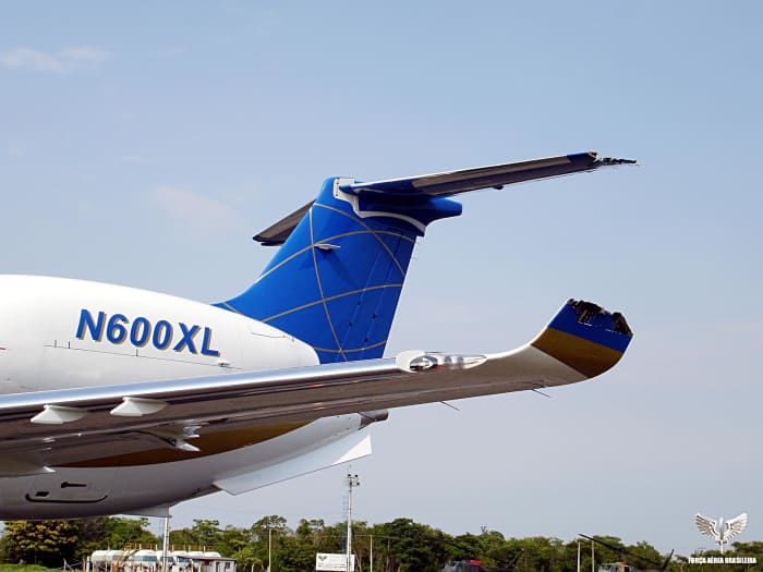 Damaged left wing and horizontal stabilizer of the Embraer Legacy jet