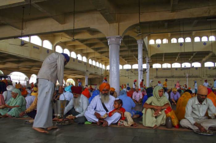Langar being served and eaten