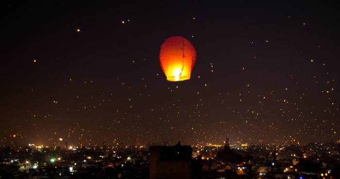 The Night Lit Up on Makar Sankranti Uttarayana Festival with Kites and Lights.