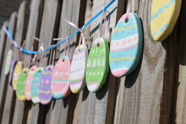 Bright Hand Painted Easter Eggs Comprises this Easter Garland on an Exterior Railing