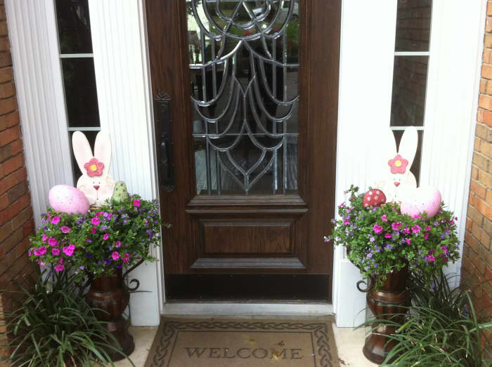 Front Door with Easter Decorations with leaded glass entry door with Easter bunnies in the side planters