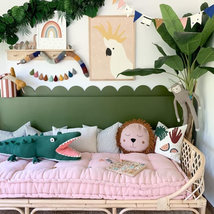 Kids pink and green decor. Jungles art theme for children’s room. The rattan children’s furniture. A neat rainbow wall art!