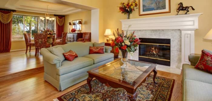 Red should be a dominant color in the Leo living room. Add curtains to the window to make it look royal.