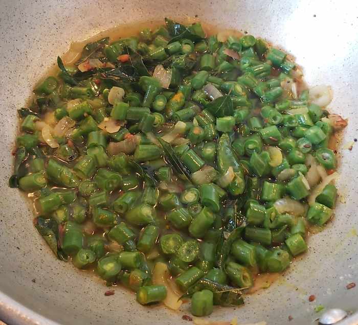 Add about 1/4 cup of water (you can cook beans in its own moisture without adding any water if the beans are very tender or add very little water just to cook beans).