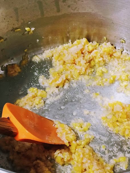 add 1/3 of the oil. when hot stir fry garlic for 30 seconds on low heat, then add ginger and repeat.