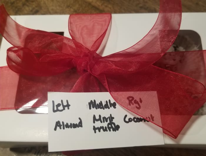 Make your truffle box attractive with a ribbon, and identify the truffle varieties for the recipient. Write or print out your truffle descriptions.