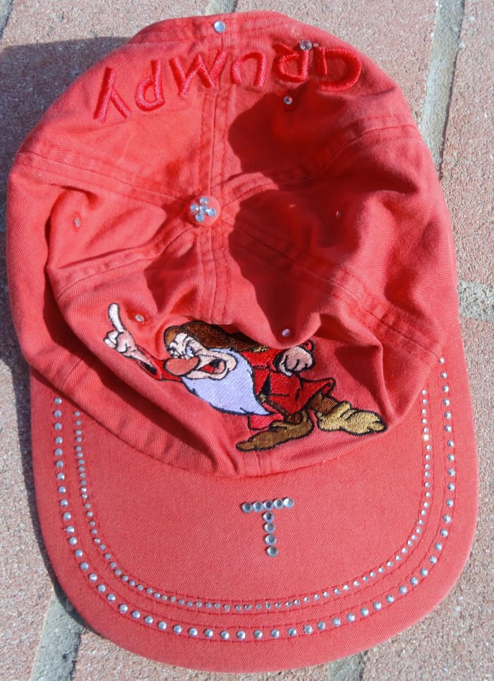 Here, I used a combination of rhinestones and rhinestuds to dress up this hat I had worn when I was 6-7. The studs are on the bottom row on the brim.