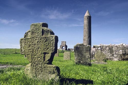 Devenish Island, N. Ireland. Notice the round tower built by the Celts and very typical of their architecture. Also, notice the Celtic cross. N. Ireland was Christianized by St. Columba.