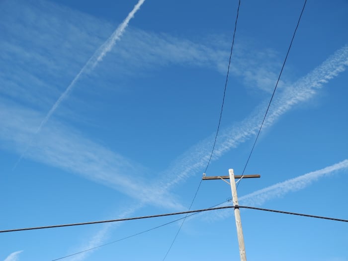 I was walking my dogs and witnessed a complete chemtrail attack resembling crop dusting. The area that I was walking in, was completely COVERED with chemtrail planes flying non-stop cross grid patterns in the sky, quickly distributing into Clouds.