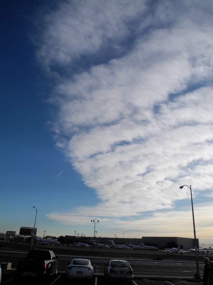 In a matter of about an hour or so, you have a completely EXPANDED Cloud-like formation. If you didn't see the original Pencil Thin Line Aerosol Plane Fly By, then you could argue that "these are JUST Clouds"... no big deal. (But they aren't).