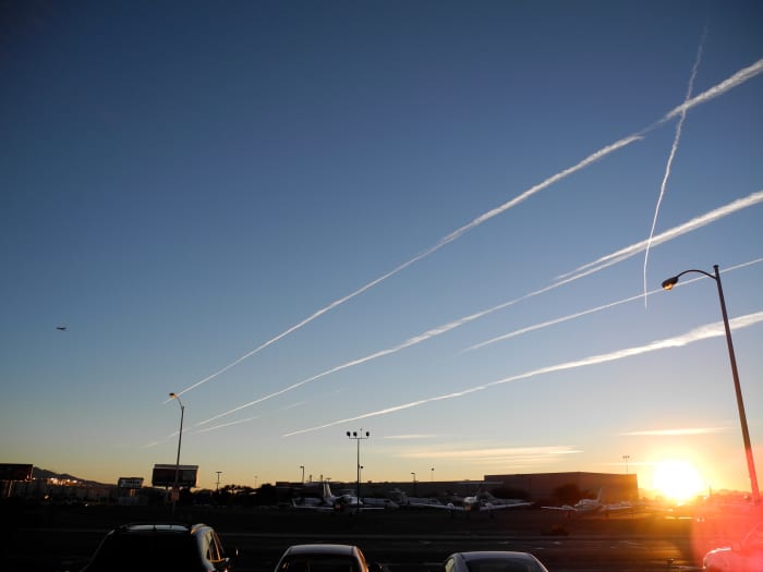 Caught in the Act!!! 7:30 am dog walk, open the door to a full on Chemtrail Attack, planes flying horizon to horizon. Pencil thin lines later morph into Huge Clouds. (You are viewing Chemtrail plane tracks glistening in the sun like a Spider's Web).