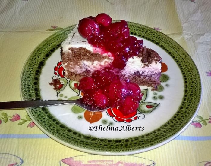 A slice of Black Forest cake that I made last Easter with cherry filling and cherry pudding on top.
