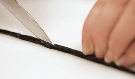 Take the tip of your paring knife and run it lengthwise down the vanilla bean exposing the tiny seeds inside.
