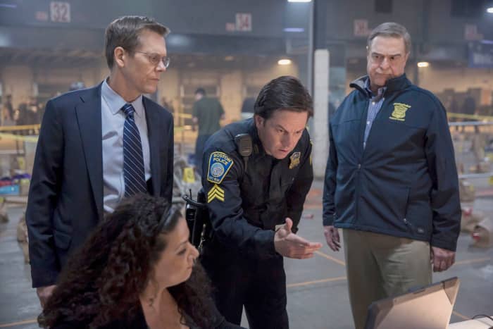 FBI agent Richard DesLauriers, Sergeant Tommy Saunders, and Commissioner Davis investigating the footage of the bombings