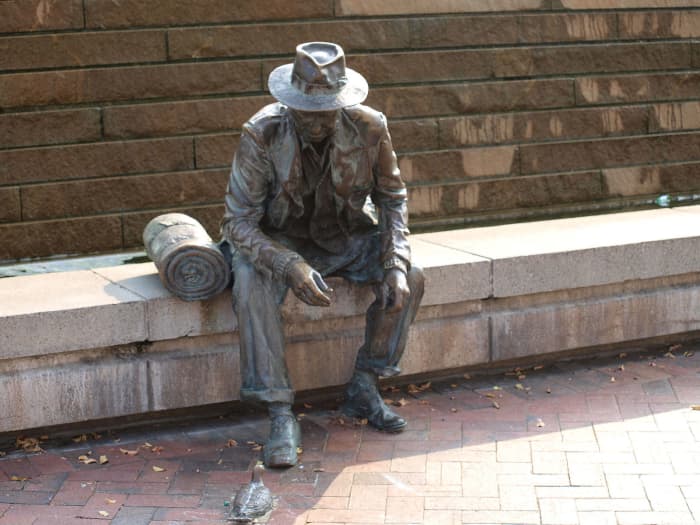 This Atlanta statue depicting a man with a bedroll feeding a pigeon pays homage to the hobos of the early 20th century.