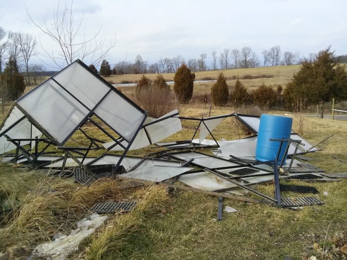 Our expensive store-bought greenhouse was destroyed by the wind. But we were able to salvage parts to build our multi-purpose garden shed.