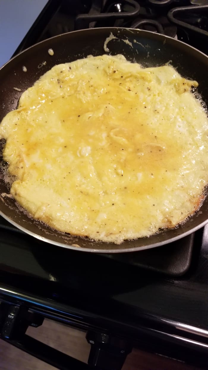 When your eggs reach this point, where they're wet but there's no pooling of egg mixture anywhere, you should cut the heat.