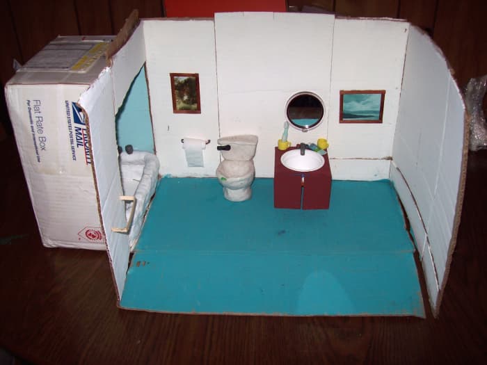 Bathroom Stop-motion set - Includes bathtub, toilet, sink, mirror, pictures, props (tooth brushes, bubble bath, cups, etc.) one box wall that pulls back for easier access for camera.