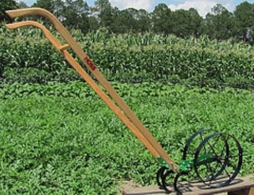The reproduction of the Pioneer Junior Wheel Hoe is still the Cadillac of hand push cultivators. It is also available at Cottage Craft Works .com