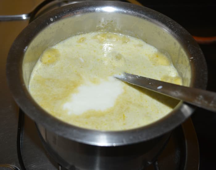 Add yogurt or thick curd, 2 or 3 cups of water, and the remaining salt. Allow the mixture to boil. Simmer for 2 to 3 minutes. Turn off the heat.