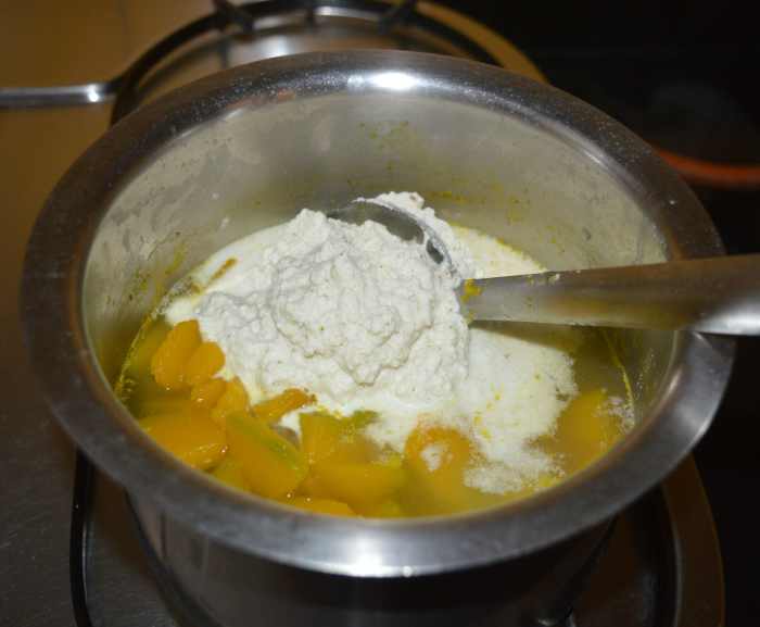 Add the paste to the vessel containing the cooked pumpkin.
