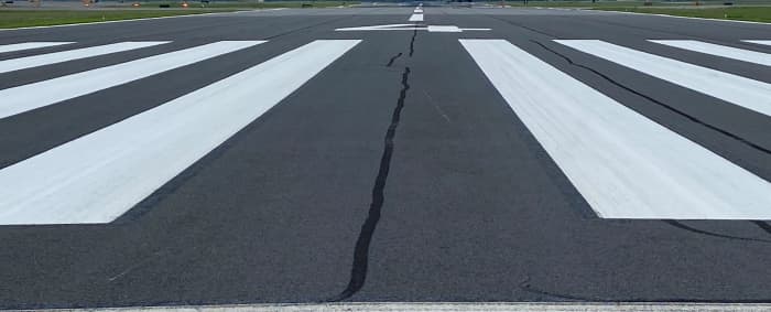 The runway designation number on each end of the runway is determined by magnetic heading. Aircraft take-off and land into the wind and the direction of traffic determines the approach end /departure end of the runway.