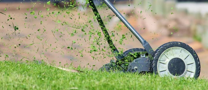 A circular frame holds the rotating blades which spin over the ground when the equipment is in motion.