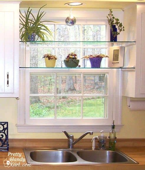 Installs your own glass shelves between two kitchen cabinets. Several are some of the plants. The glasses are shelves between the cabinets and over the window and above the sink.