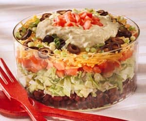 Layered Chicken Taco Salad - customize this quick, easy, healthy salad to your own tastes. Add your choice of tomatoes, sour cream, salsa, olives, onions, scallions, avocados, cheese, and lettuces.