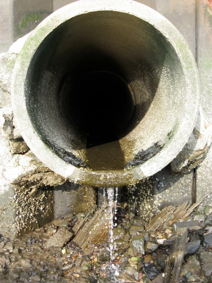 During heavy rain in Bayonne, New Jersey, raw sewage is discharged into bodies of water via this pipe.