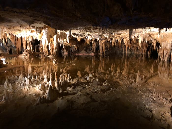 The Luray Caverns were discovered after a group of explorers noticed cool air emanating from a sinkhole near a limestone outcrop.