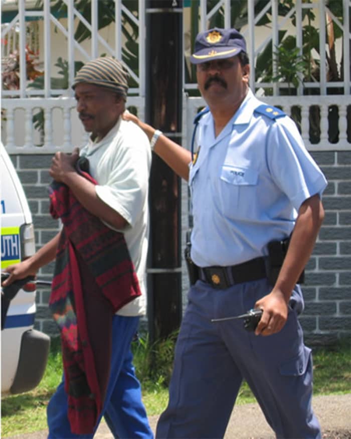 Remember the days of Apartheid. The more things change the more they stay the same, if not worse. A protester being led away by a cop.