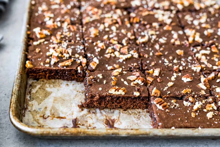 In 1966, Texas sheet cake was a real crowd-pleaser. This “huge, gooey chocolate cake, topped with frosting, pecans and walnuts,” is a regular at Texan funerals.
