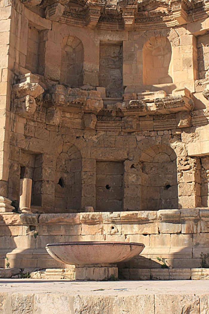 The late 2nd century Nymphaeum, or public fountain near the Temple of Dionysus. The large bowl collected the waters of the fountain
