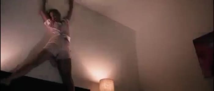 She gets dragged around onto the walls and ceiling by the way, just like in A Nightmare on Elm Street... ya know... like I'm sure the real life Nicole Simpson went through.