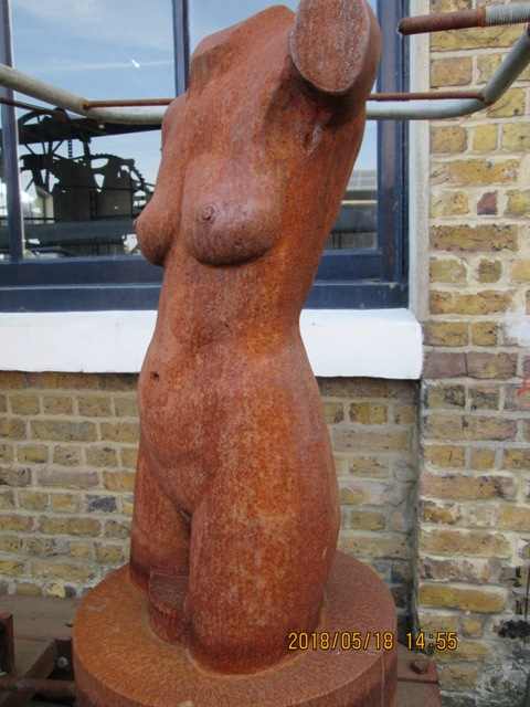 Outside the Parkour Academy, this well-endowed young woman lost her head to the sculptor - sorry, welder. He's an artist all the same...