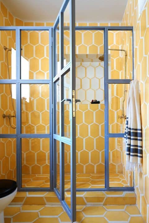 The tile in this bathroom looks like eggs, which is appealing to the Chinese Zodiac Rooster. Yellow is also a good color for this sign. They like big glass doors for their showers.