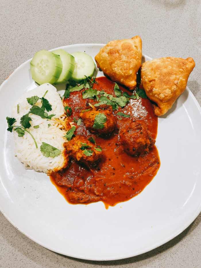 A delicious dinner with homemade samosas on the side