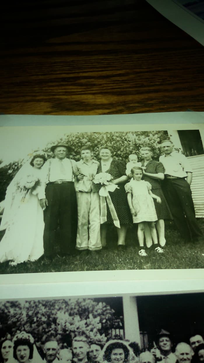 The Schmidt family. From right to left: grandpa Schmidt, grandma Schmidt holding aunt Mary, aunt Donna standing in front, unknown woman, uncle Leo, great-uncle Henry Schmidt, and aunt Sissy