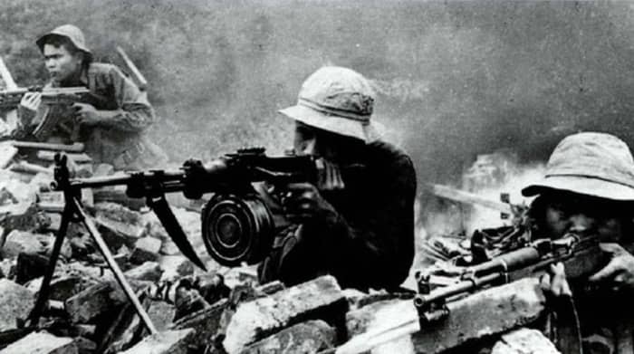 NVA firing at American Marines during the battle for Hue. Around 8,000 NVA regulars or VC insurgents lost their lives in Hue.