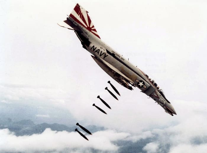 An American F-48 VF111 bomber in Vietnam. Chief of Staff of the United States Air Force Curtis LeMay stated that "we're going to bomb them back into the Stone Age".