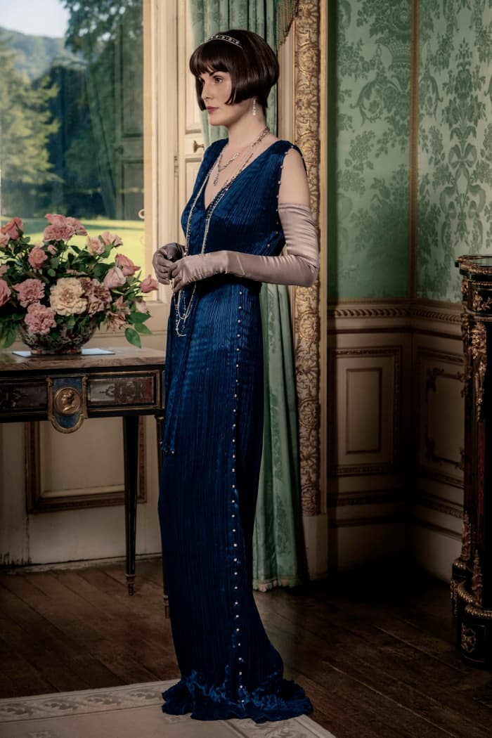 Two pieces that stand out are the Fortuny dresses, marked by the textile house's signature fine pleats.