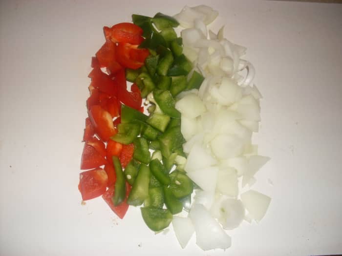 Colorful, flavorful and delightful, the green pepper, red pepper and onion adds pizzazz for this delicious paella recipe.